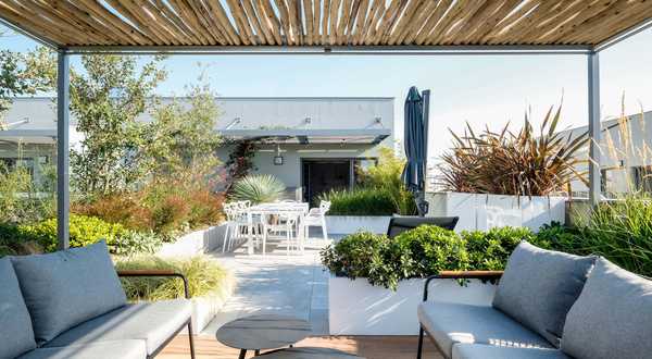 A landscape designers renovates a pool space in a garden in Toulon